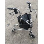 A three-wheel trolley walker with adjustable handlebars, brakes and chrome frame around a triangular