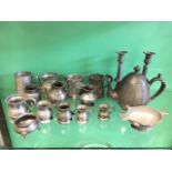 A collection of nineteenth century pewter including tankards, a pair of bead moulded baluster
