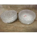 A pair of circular 70s flowerhead moulded clear glass ceiling light fittings in metal frames. (12in)