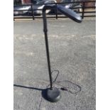 A modern Lifemax standard/reading lamp, with column on weighted base supporting adjustable arm, with