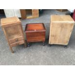 A square mahogany sewing cabinet, the hinged lid enclosing a lined compartment above two drawers;