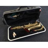 A hard cased Elkhart Series II saxophone, complete with spare reeds, shoulder strap, cleaning pipes,