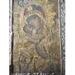 A Russian style icon, the mother & child with handpainted gilt highlights within foliate embossed