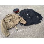 A 1959 REME Colonels battledress jacket and a blue serge dress coat, together with a cap by George