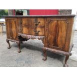 A mahogany Chippendale style sideboard, the rectangular top with bowfronted centre section having