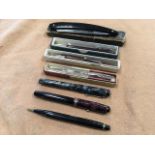 Four propelling pencils including a plated yard-o-lead, marbled bodied, Henley, etc; a cased cut-