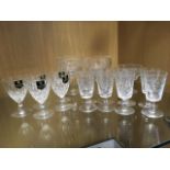 A set of six Edinburgh & Leith tapering sherry glasses with cut decoration; a set of five