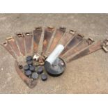 Miscellaneous tools including eleven various saws, casters, a paraffin greenhouse heater, a scythe