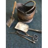 A helmet shaped copper coal scuttle with swing handle; and various fire tools - poker, shovel,