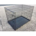 A rectangular dog cage, the folding pen on tray base. (42in x 29in x 32in)