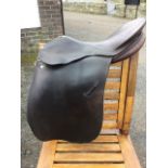 A Richmond leather dressage spring tree saddle by Triumph Walsall.