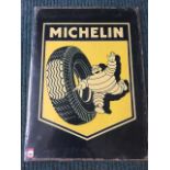 A reproduction enamelled metal sign advertising Michelin tyres. (20.5in x 28in)