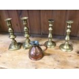 A pair of nineteenth century brass candlesticks of baluster form with circular bases; a half-pint