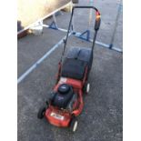 An Efco rotary mower with Briggs & Stratton petrol engine, complete with grassbox.