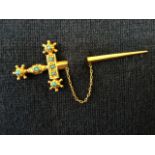 A Victorian gold pin brooch, modelled as a sword with tapering scabbard and bead decoration to hilt,