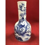 A Chinese blue & white bottle vase with tubular neck and mallet shaped body, decorated with