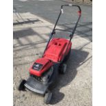 A Mountfield petrol lawnmower with grassbox, having Briggs & Stratton HP470 engine.