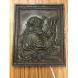 A nineteenth century heavy bronze plaque depicting Moses with book volume, in moulded frame. (8in