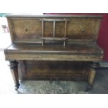 A John Brinsmead & Sons walnut cased piano, with cast iron frame and panelled case fitted with brass