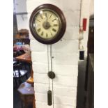 A Victorian 'wag ô the wall' clock, with moulded mahogany frame and brass bezel enclosing painted