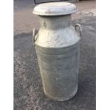 A Grundy aluminium milk churn & cover with side handles to shoulders. (29.5in)