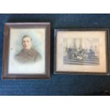 An oak framed hand-tinted photograph of a young soldier; and an Edwardian family photograph on the