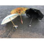 A Victorian black parasol with floral lace trim and carved wood handle; a handpainted Japanese