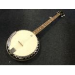 A Ridgewood five-string banjo with Remo drumhead, and the fingerboard inlaid with mother of pearl