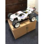 A 1:8 scale 4x4 Ho Bao nitro powered racing truggy, the model with instructions, radio control