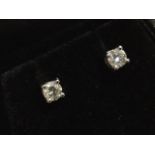 A pair of 18ct gold diamond stud earrings, the claw set brilliant cut diamonds of just over a