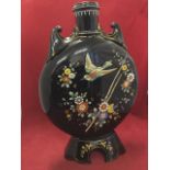 A large Victorian oriental style moon flask, the glass vessel with scrolled mounts to shoulders