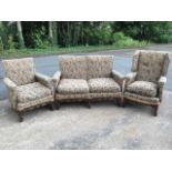 A Parker-Knoll oak cottage suite, with 'his & hers' armchairs and two-seater sofa, having loose