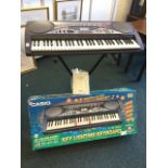 A boxed Casio electronic keyboard, the instrument with twin speakers, over 100 effects,