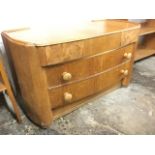 A 60s oak bowfronted dressing table, with three short frieze drawers - two burr walnut, above two