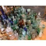 A collection of 'dug-up' bottles - medicinal, cooking, chemical, scent, ink, wine, some with