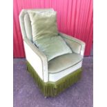 A nineteenth century upholstered armchair, the padded rectangular back above a sprung seat with