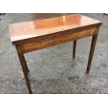 A nineteenth century mahogany turn-over-top tea table, the twin top with reeded edge above a