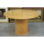 Modern birch veneered Skovby table, circular top twisting to expand, on circular plinth,