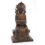 Chinese bronze and gilt splashed figure of a Daoist deity seated,