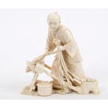 Fine quality late 19th century Japanese Tokyo School carved ivory okimono of a farmer threshing the