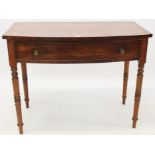 Victorian mahogany bow front side table with single drawer, on ring-turned tapered legs,