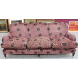 Large modern three-quarter sofa, puce foliate upholstery, on square tapered legs and castors,
