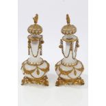 Pair of 19th century Bohemian opaque glass and gilt metal mounted scent flasks and stoppers,