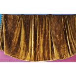 Pair of good quality interlined bronze velvet curtains with shear arrow-head motif and tassel seam,