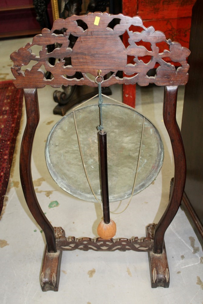 Late 19th / early 20th century Chinese carved hardwood gong stand with tooled metal gong and beater, - Image 10 of 12