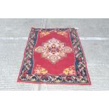 Kelim rug - with claret ground and central medallion in main foliate border,