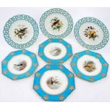 One set of three and one set of four Victorian Minton dessert plates painted with exotic birds,