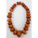 Old amber bead necklace with a string of twenty-seven exceptionally large graduated amber beads,