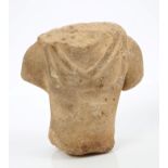 Ancient, probably Roman, carved stone torso of a male figure wearing a toga,