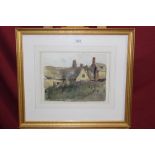 *Lawson Wood (1878 - 1957), watercolour - View of cottages, signed, in glazed gilt frame,